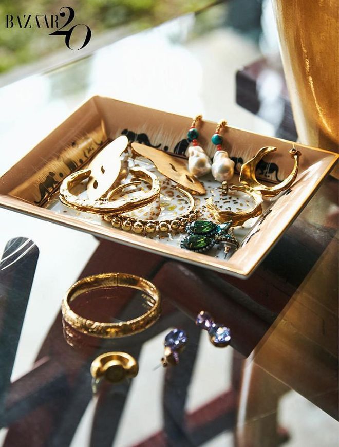 A Cartier jewellery tray holding a Bvlgari bracelet, Roxanne Assoulin earrings, assorted pieces sourced in Spain and a ring that is a family heirloom.

(Photo: Phyllicia Wang)
