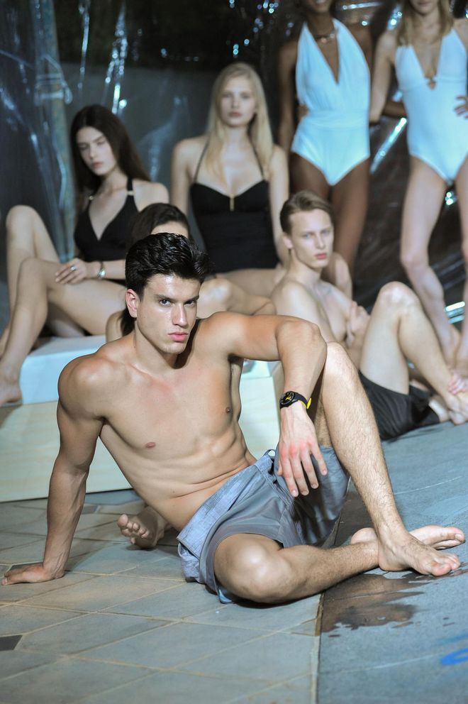 Calvin Klein models lounging by the poolside