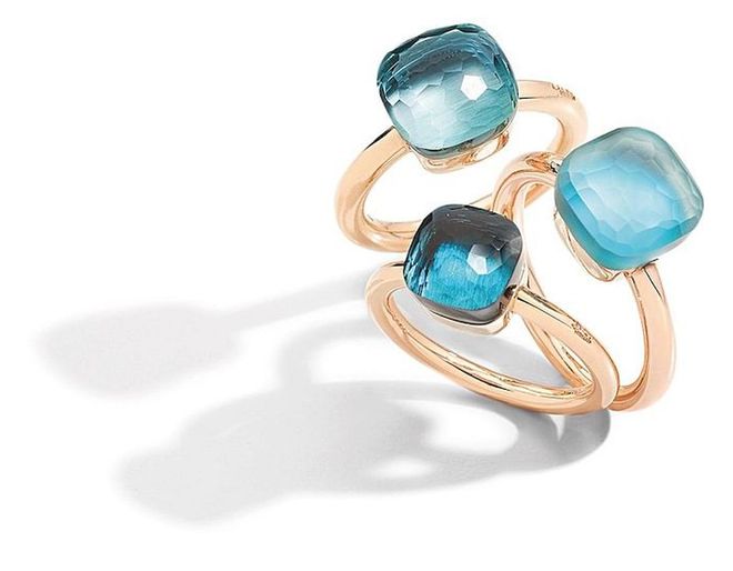 From top: Rose gold, white gold and blue topaz Nudo Classic ring; rose gold, white gold, blue topaz, mother-of-pearl and turquoise Nudo Gelé ring; rose gold, white gold and London blue topaz Nudo Petit ring. (Photo: Pomellato)