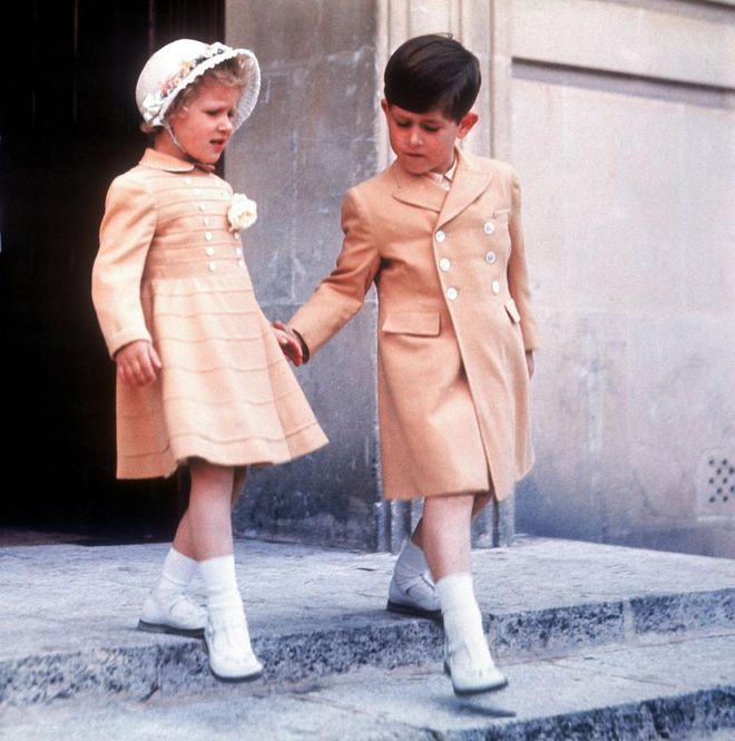 Prince Charles sweetly takes his sister Anne by the hand in Malta, where they were with their parents on a royal tour.
Photo: Getty 