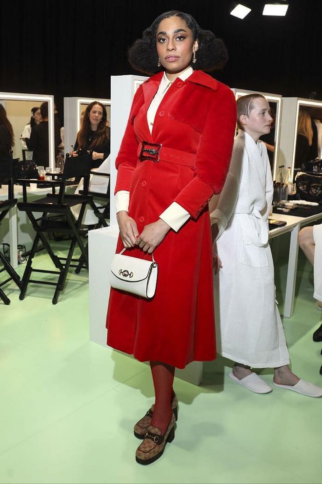Celeste wore a red coat-style dress and heeled Gucci loafers.

Photo: Victor Boyko / Getty
