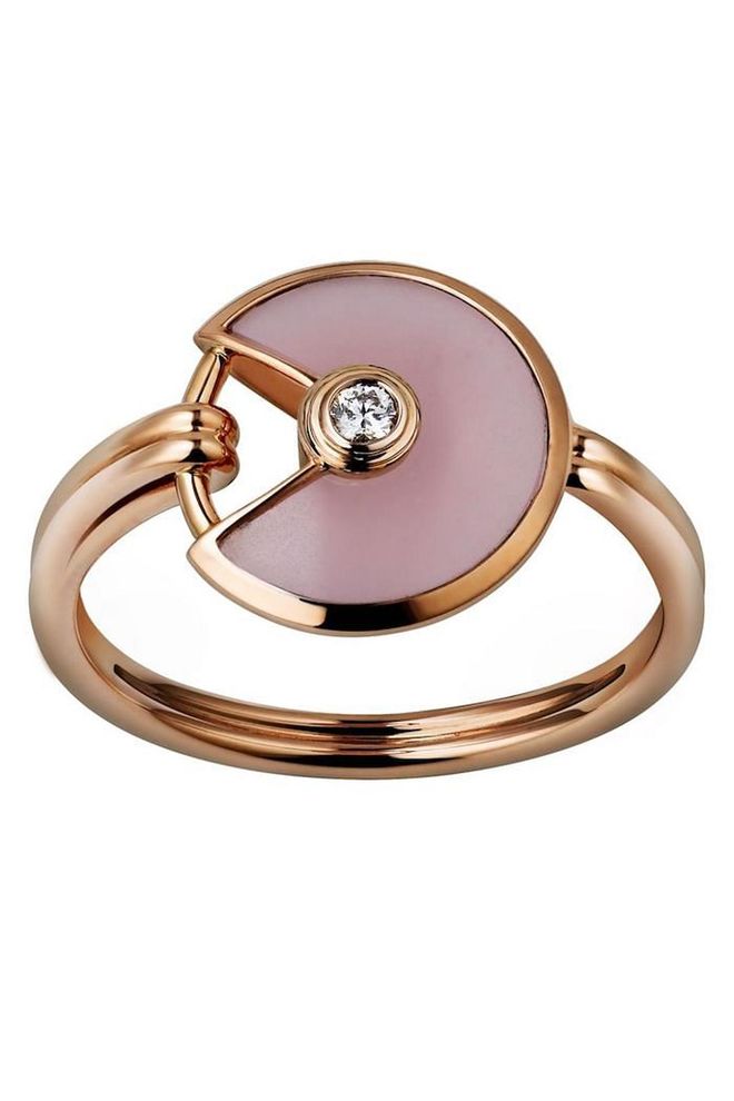 "Amulette de Cartier" ring, with rose gold opal, and diamond, $2,740, cartier.com.
