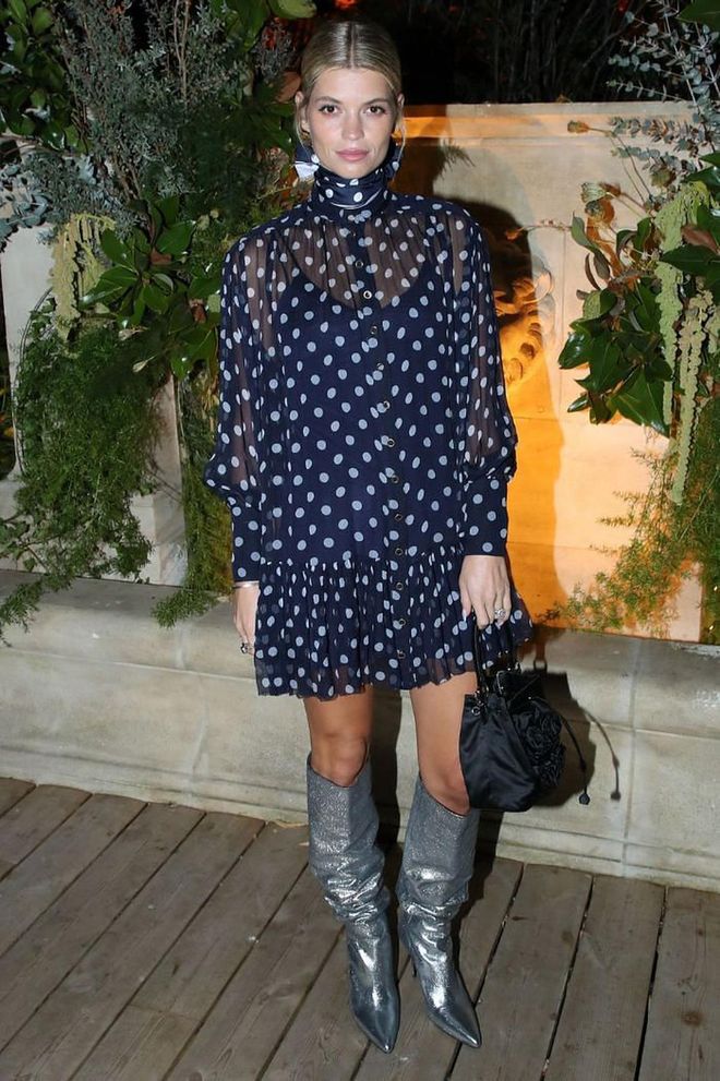 Pixie Geldof teamed a polkadot Zimmermann dress with silver metallic cowboy boots for the cocktail party.

Photo: Getty