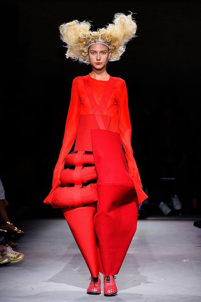 For spring/summer 2014, the designer presented a collection based around red – in equal parts romance and anger. Crazy hair, exaggerated shapes and red, red, red. Photo: Getty