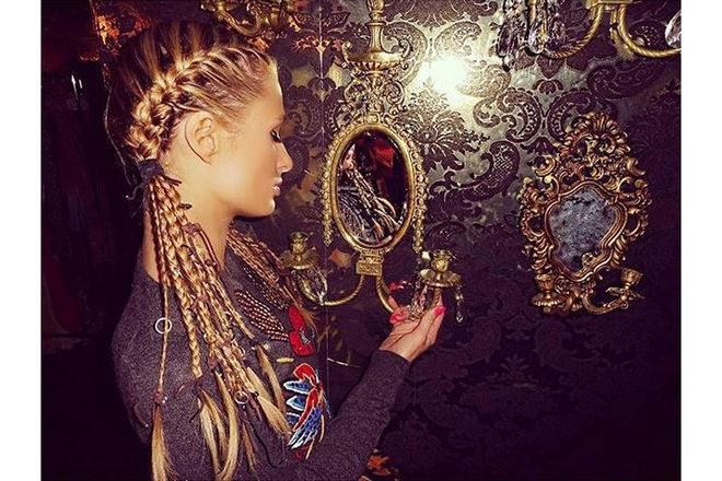 Paris Hilton sported a mix of French braids and several skinnier plaits, which hairstylist Chris Dylan embellished with rugged leather hair wraps and delicate metal rings.
