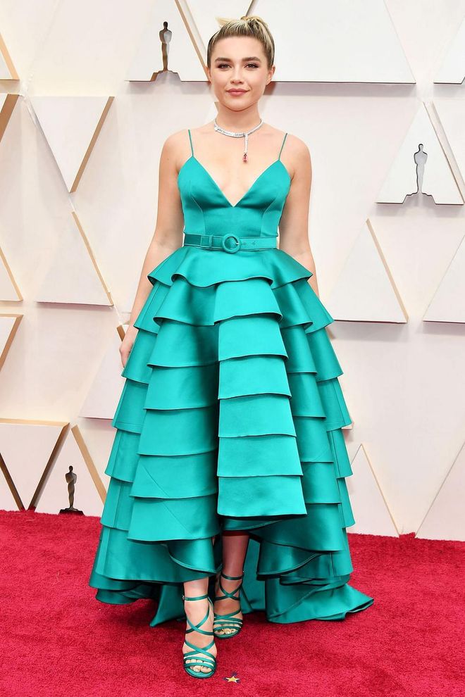 What: Louis Vuitton dress, Louis Vuitton High Jewelry, and Maria Tash earring

Why: This tiered custom gown in a vibrant shade of Kelly green is youthful and sweet, befitting the young actress. An eye-catching necklace finishes the look. Photo: Getty