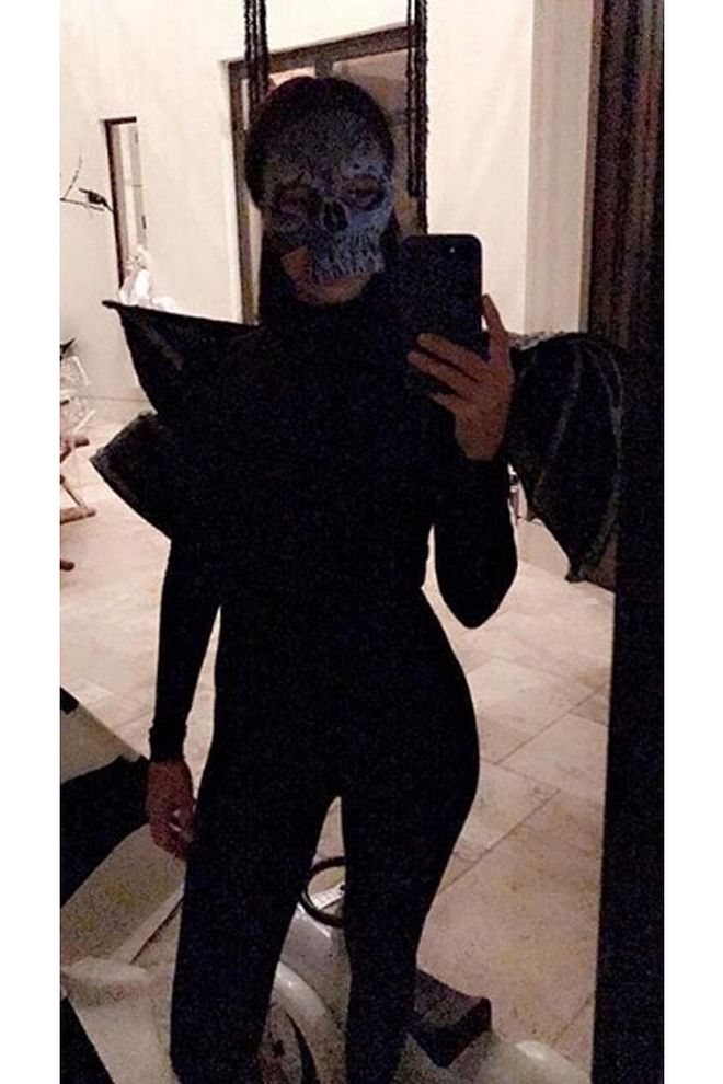 The oldest Kardashian sister dressed as a skull demon.