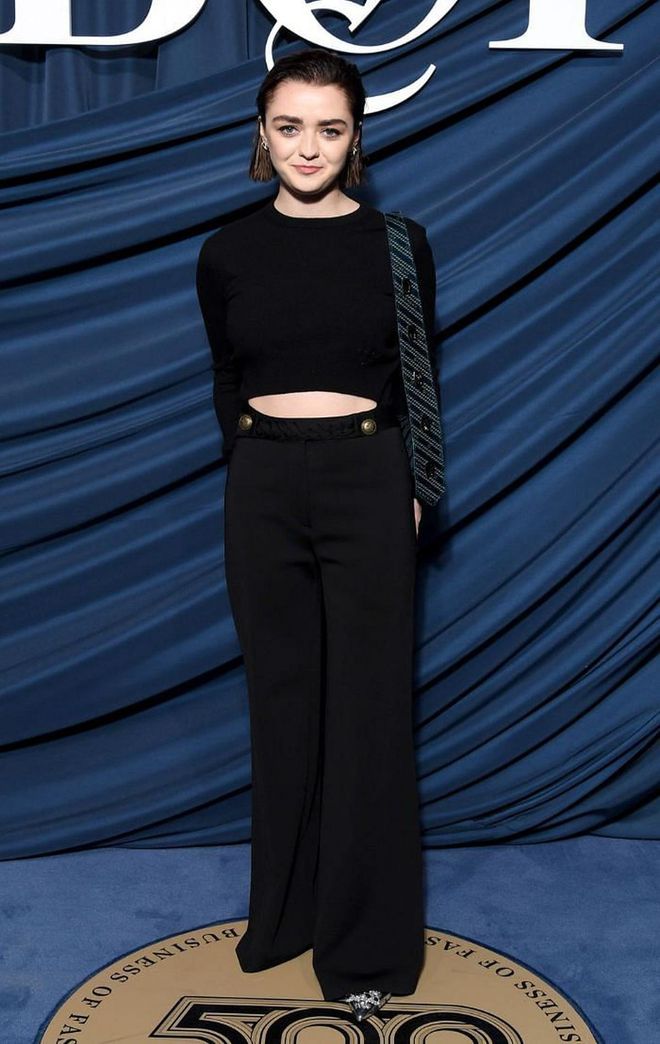 Maisie Williams wore a black crop top with high-waisted black trousers for the gala.

Photo: Getty