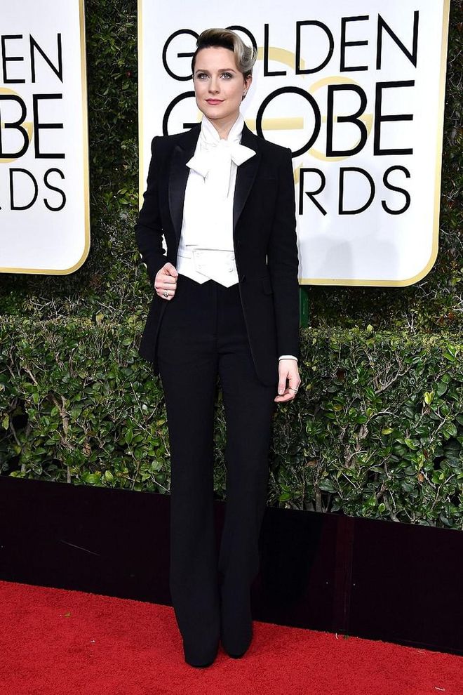 Evan Rachel Wood looked smart and chic in a custom suit by Altuzarra for the Golden Globes red carpet. Brides who have no desire to wear white and don't feel like themselves in full skirts or feminine gowns should take notes - stick with perfect tailoring, strong shoulders and feminine details that separate your feminine tux from the boys'.  