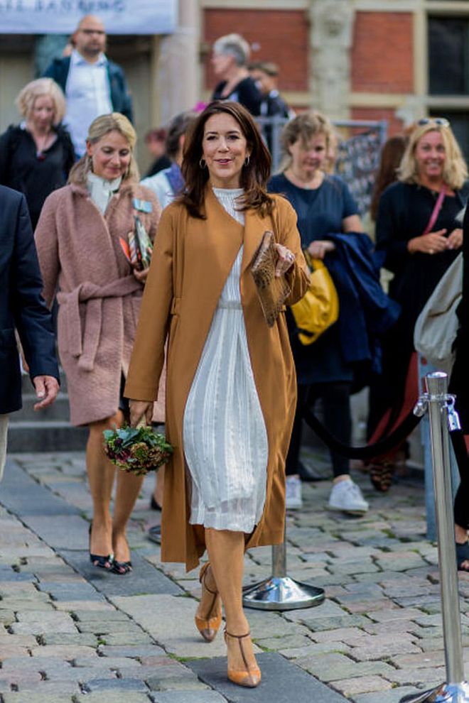 She's a busy mother of four, but that doesn't stop her from supporting Denmark's third largest export: fashion (she's pictured here at Copenhagen Fashion Week). The Princess has always maintained an air of approachability; Copenhagen residents often see her riding around on her bike with her children.