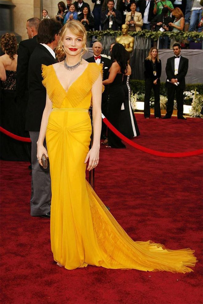 Michelle Williams's saffron Vera Wang dress has become one of the most memorable fashion moments. The actress attended with her then-boyfriend, the late Heath Ledger, who was nominated for his role in Brokeback Mountain, where they both met.