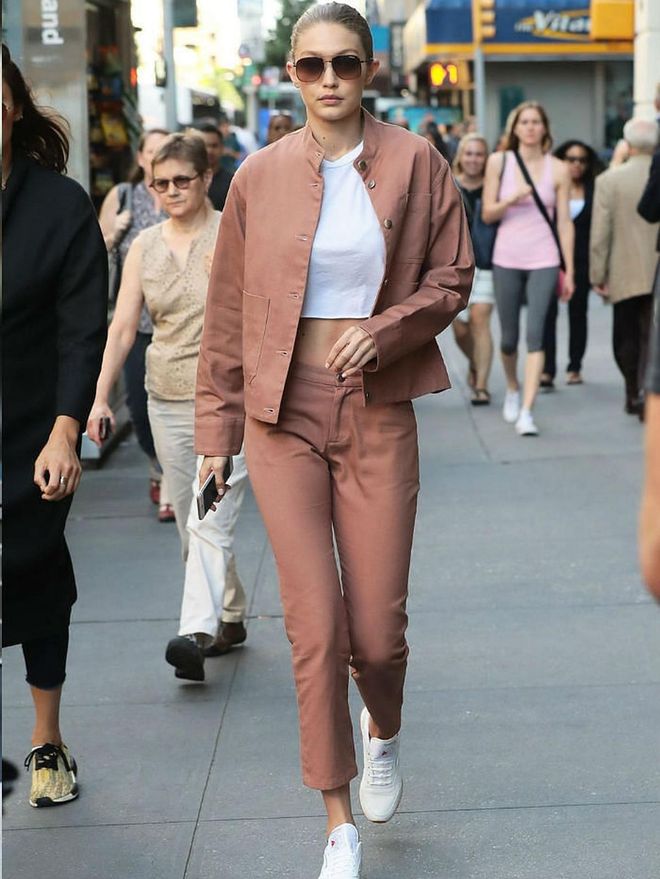 Whether a classic pantsuit or a sportier version à la Gigi Hadid, a pair of classic, clean white Reebok sneakers is a no-fail way to make a two-piece set look cooler.