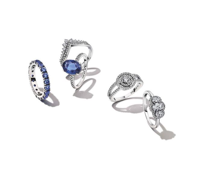 From far left: Sterling silver Sparkling Row Eternity ring with princess blue crystals, $159; Princess Wishbone ring, $129; Sparkling Statement Halo ring with a princess blue crystal, $159; Sparkling Double Halo ring, $159; Three Stone Vintage ring, $159 (Photo: PANDORA)