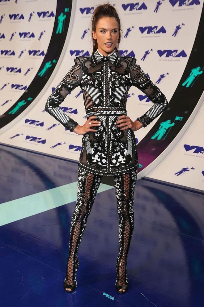 In a mesh-paneled mini with lace-up boots. Photo: Getty 