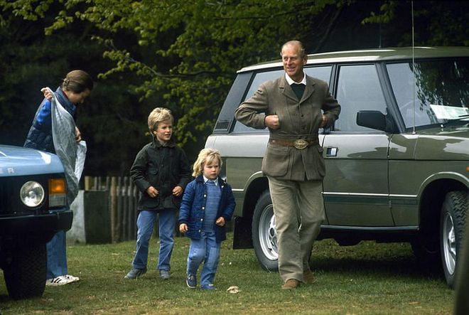 Granddad on duty! Zara and Peter Phillips walk with their grandfather, Prince Philip, at a horse show.
Photo: Getty