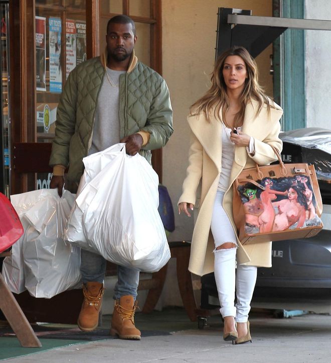 51292537 Couple Kim Kardashian and Kanye West out doing some shopping at a sporting goods store in Los Angeles, California on December 26, 2013. Kim was rocking a purse with naked ladies painted on it. FameFlynet, Inc - Beverly Hills, CA, USA - +1 (818) 307-4813