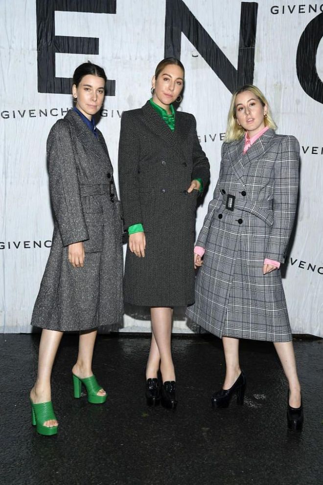 Este, Danielle Haim and Alana Haim all attended the show in sharp tailored coats.

Photo: Getty