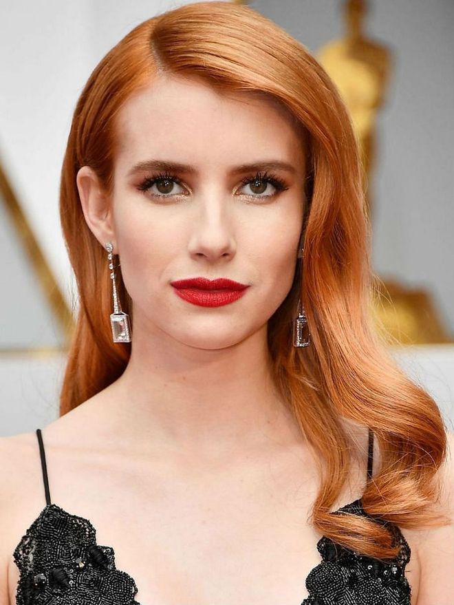 Emma Roberts tapped makeup artist Charlotte Tilbury to create one of the most beautiful bombshell makeup looks of the year. We're calling this New Hollywood: it's Old Hollywood classic like a red lip and golden eye done in a way that feels decidedly modern.