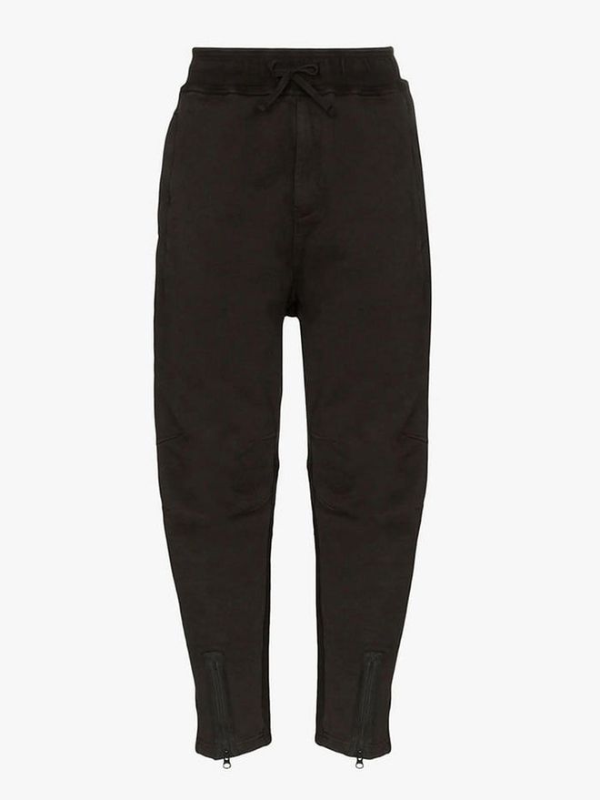 Comprising an elasticated waist with self-tie fastening, side pockets, a zipped rear pocket, a relaxed fit, and elasticated cuffs with zip detail, these Stone Island joggers are the ultimate lounge-around pants. Available on Browns.