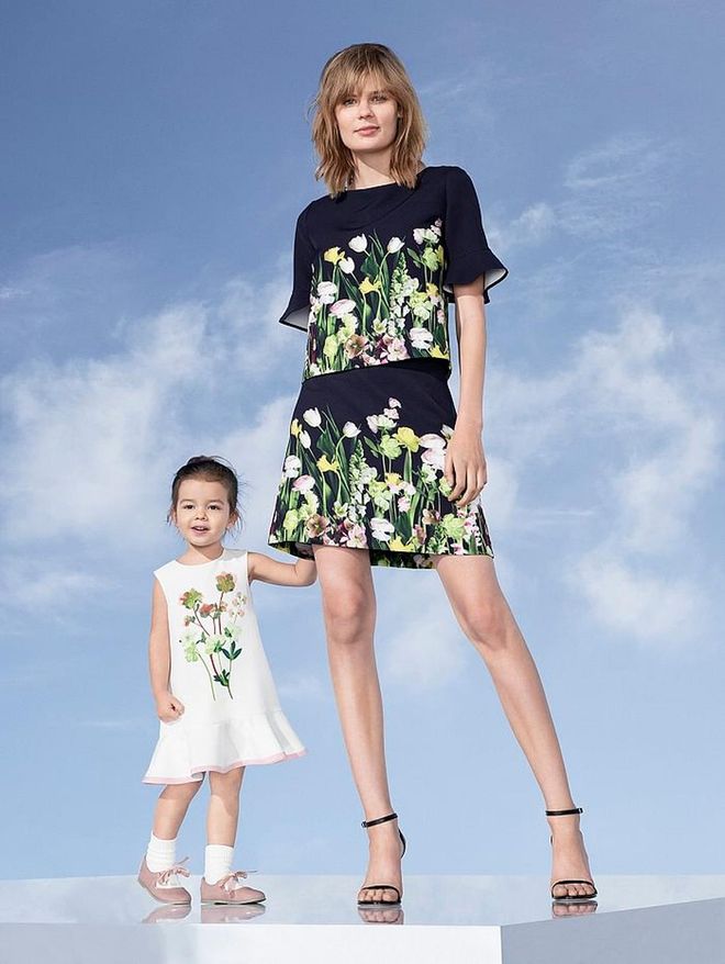 Toddler Girls' Floral Satin Dress, $23; Women's Black Satin Floral Top, $28, and skirt, $30. Photo: Target 
