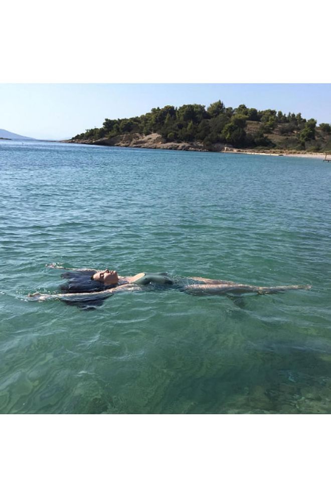 While vacationing in Greece with Michael Kors, the model shared a snap of herself floating in the ocean. Photo: Instagram