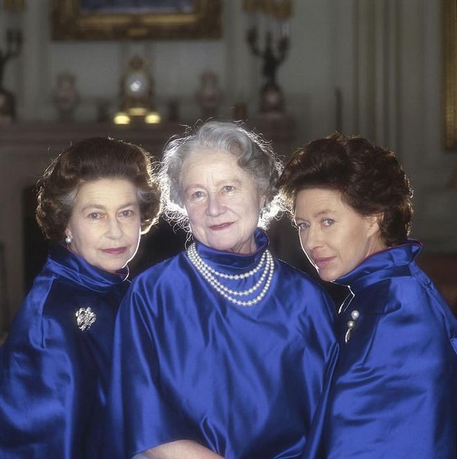 Queen Elizabeth II, her mother, and Princess Margaret pose for an official portrait in matching cobalt satin jackets. Nearly two decades later, in 2002, Margaret and the Queen Mother passed away a month apart from each other.

Elizabeth II and her sister had a close-knit relationship and "a love, friendship, and conspiracy that were impressive to behold," according to Vanity Fair. Margaret reportedly had a direct phone line at Kensington Palace to her older sister, which she'd often use to chat and gossip with her sibling.