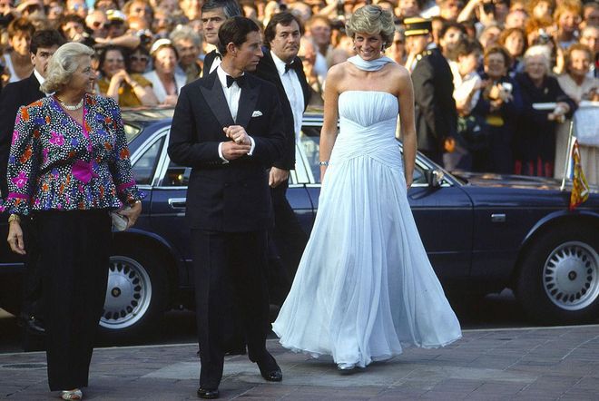 In a pale blue chiffon Catherine Walker gown and stole while arriving to Cannes Film Festival with Prince Charles. Photo: Getty