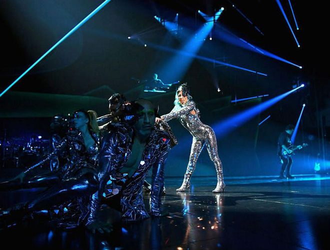 Covered in tiny mirrors, and with built-in heeled boots, Lady Gaga performed a dance routine while wearing her bejeweled catsuit, because she's Lady freaking Gaga.