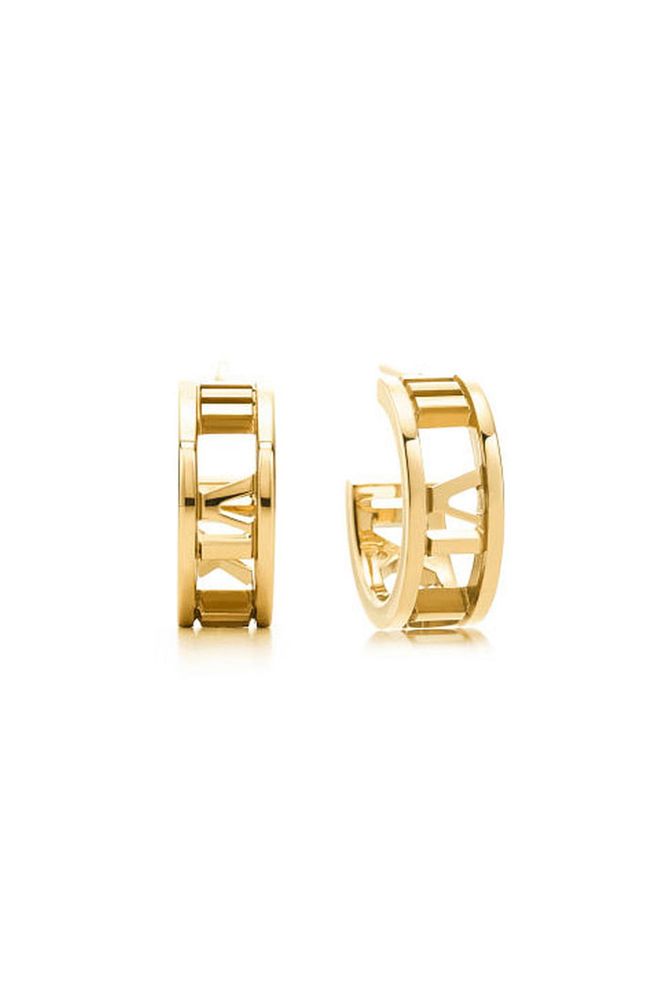 A pair of discreet gold hoops in your armoury ensures that even on a jeans-and-T-shirt day you can feel polished on the jewellery front. We love Tiffany's roman numeral emblazoned Atlas hoops for added elegance.
Atlas hoop earrings in 18k gold, £770, Tiffany & Co