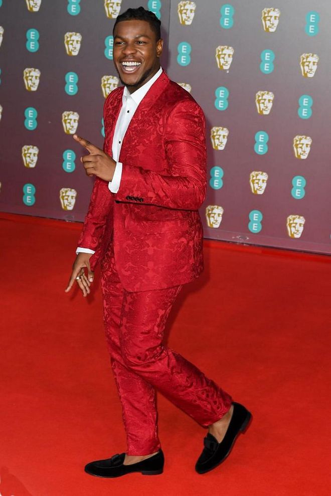 John Boyega brightened up the carpet in a bright red brocade suit.

Photo: Stephane Cardinale / Getty