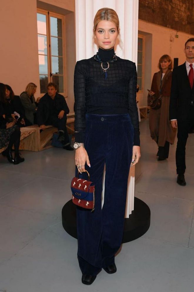Pixie Geldof attended the show in a sheer turtleneck with a Chloe bag.

Photo: Getty
