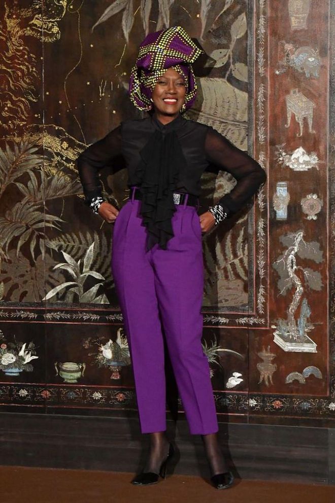 Singer Khadja Nin teamed a pair of purple high-waisted trousers with a sheer blouse and printed turban.

Photo: Getty