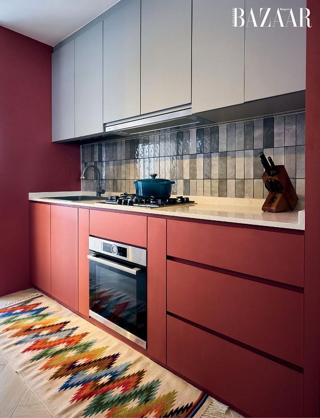 The terracoat-hued cabinetry in the kitchen is another expression of Hong’s love for colour.