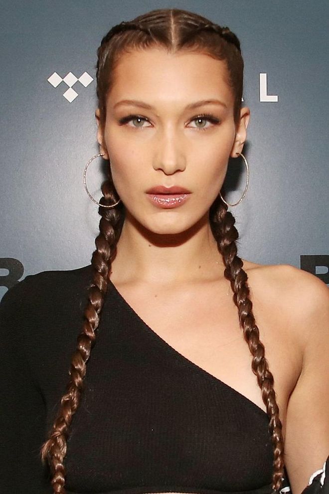 Girl power! Tightly-woven plaits looks polished on Bella Hadid's luxe, long length. Photo: Getty