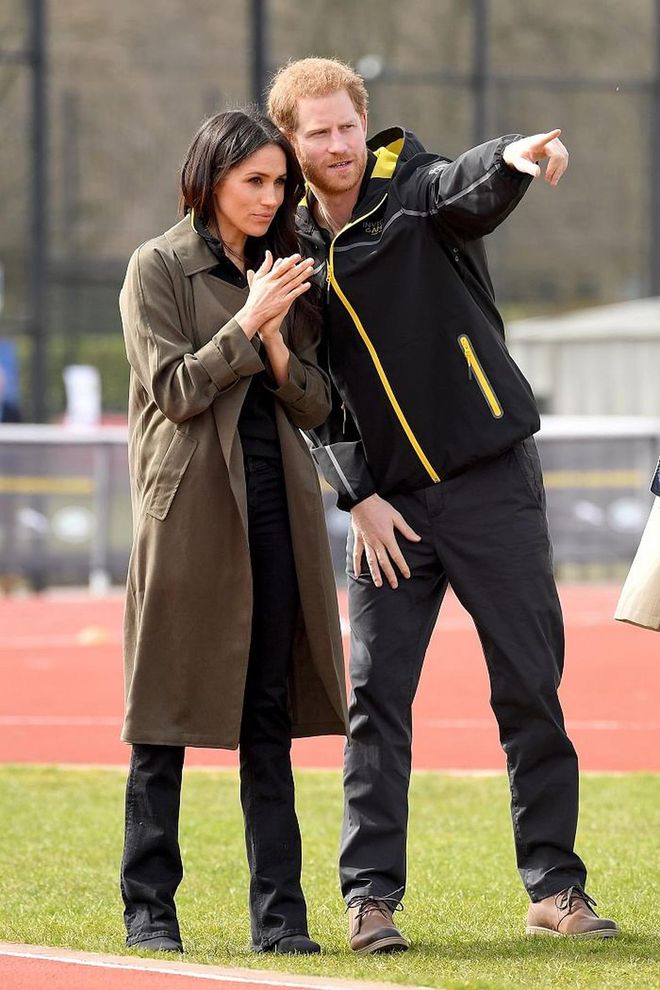 Meghan showed her support for the Invictus Games happening soon by wearing their merch. On top of that she wore a sage coloured Babaton trench coat paired with black bootcut denim by Mother. She finishes off the casual outfit with a pair of black Stuart Weitzman kitten heel boots. 