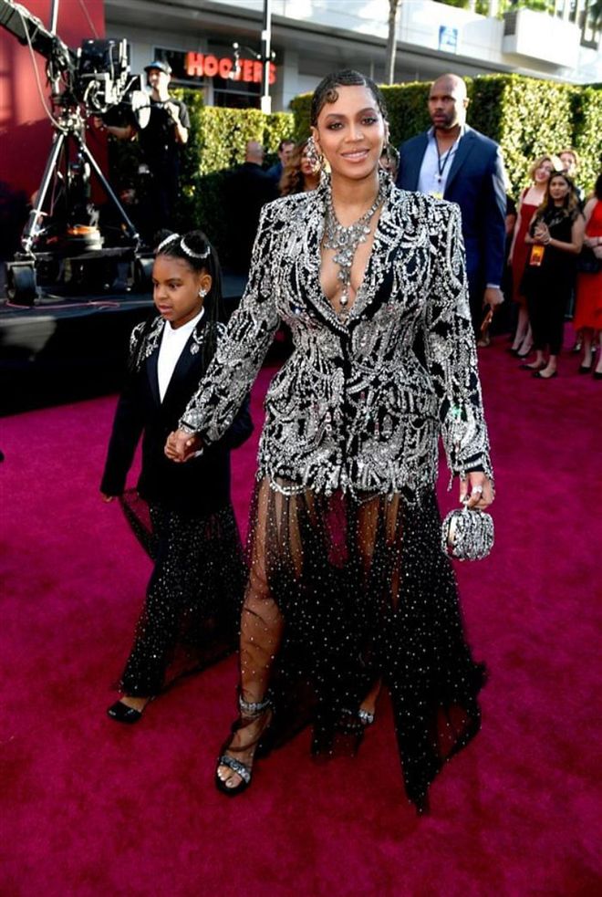 At the premier of Lion King, where Beyonce voices lioness Nala for the remake of the 1994 Disney animated feature, the starlet hit the red carpet with an equally glamorous guest – her 7-year-old daughter, Blue Ivy Carter. The duo wore matching Alexander McQueen tuxedo dresses, each with sweeping sheer skirts and dazzling details.

Photo: Getty