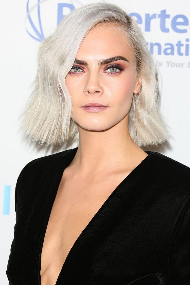 With hair Cara Delevingne's length, you only need one hot tool: a flat iron. Twist and bend the iron as you work down your strands to create these graphic bends.

Photo: Getty