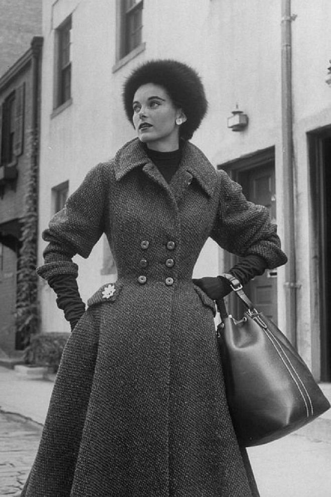 A woman in a tweed coat and fur hat.

Photo: Getty