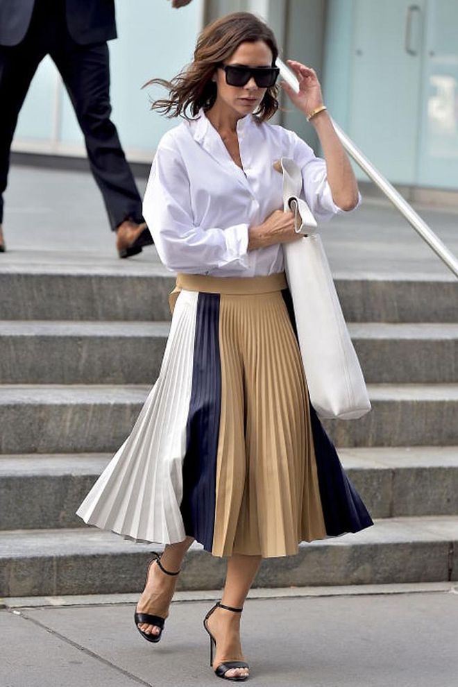 Beckham loves herself a midi skirt, whether worn with a shirt as pictured here, or a silky camisole. While it's easy to write the midi-length off as a little dowdy, they're actually an easy fast-track to autumn/winter 2016 chic.