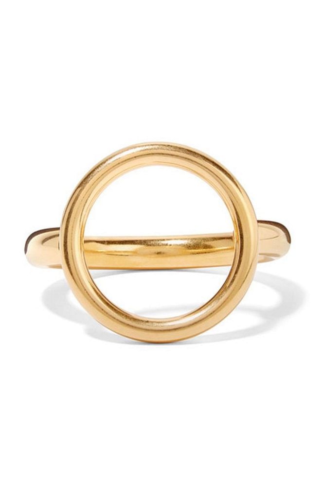 Simple, chunky and eye-catching, this gold-plated Marni bangle is a must-have for those who want to invest in a single statement piece. 