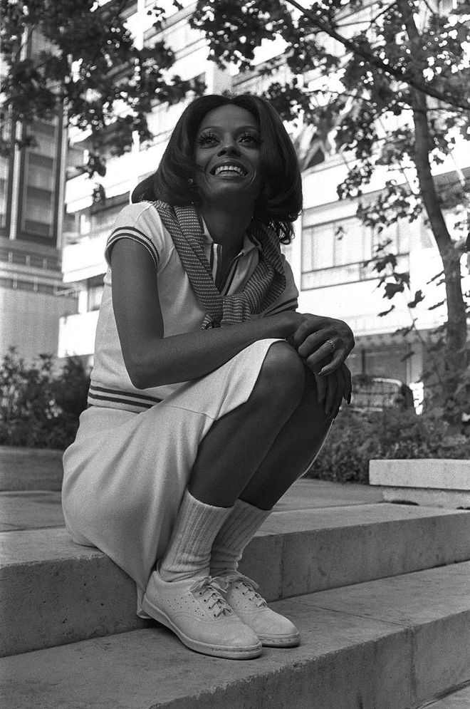 Posing in a sporty knit set and tennis shoes, outside of a U.K. concert in 1973
Photo: Getty