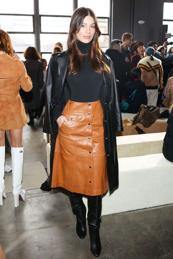 Camila Morrone attended the show in a chic leather button-up skirt and trench coat.

Photo: Courtesy of Coach