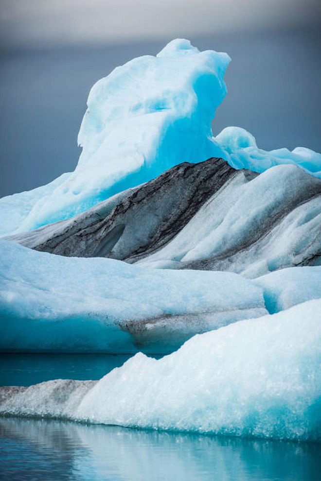 Located in southeast Iceland, the Jökulsárlón Glacier Lagoon gets its vivid blue color from the mixture of fresh and saltwater where the lake meets the open sea. Photo: Getty