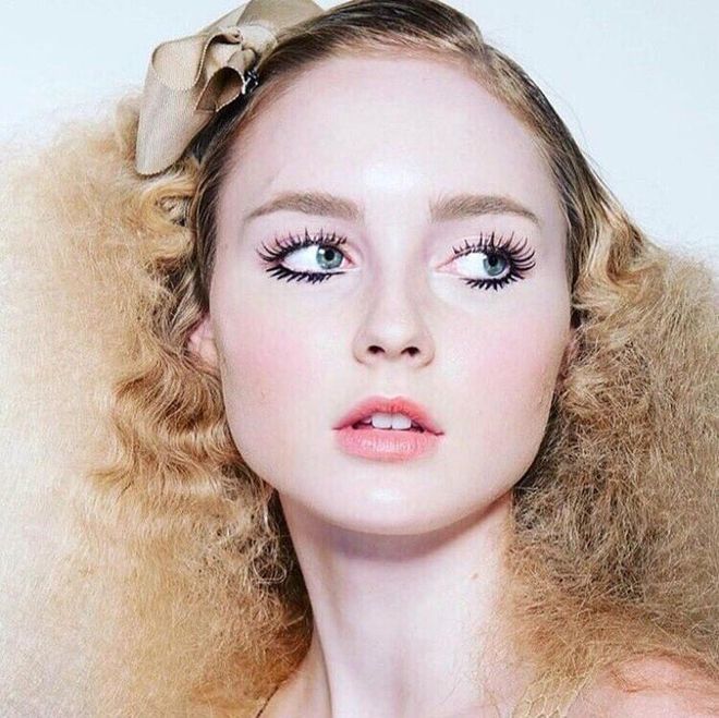 Dramatic lashes and rouged cheeks give models a doll-like effect. 