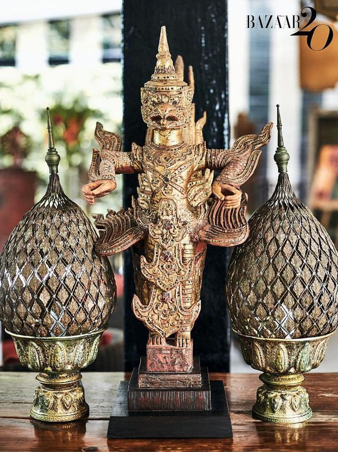 A Garuda statue and Thai lamps adorn one of the surfaces in the house.

(Photo: Phyllicia Wang)