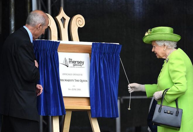 Queen Elizabeth does the honors. Photo: Getty