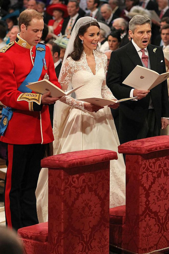 Prince William, his bride, and her father sing during the ceremony.

Photo: Getty