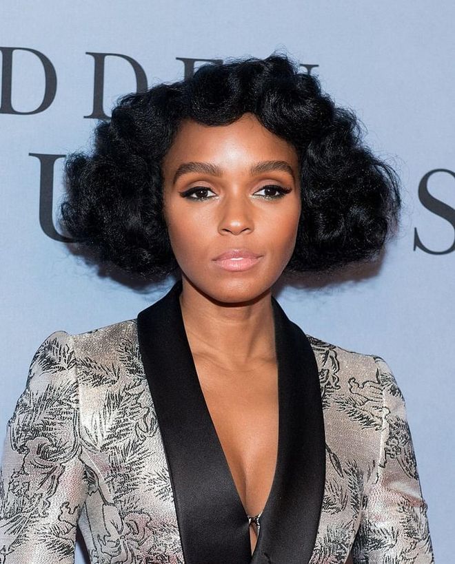 Monáe's been experimenting with all kinds of beauty looks for her Hidden Figures press tour, from Minnie Mouse ears adorned with safety pins to extravagant top knots. But for the everyday, we're all about the sophisticated puffy curls that give this blunt look so much more character. 