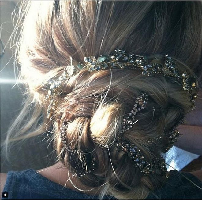 Jennifer Lawrence's braided bun with three whole headbands weaved throughout. Photo: @marktownsend1
