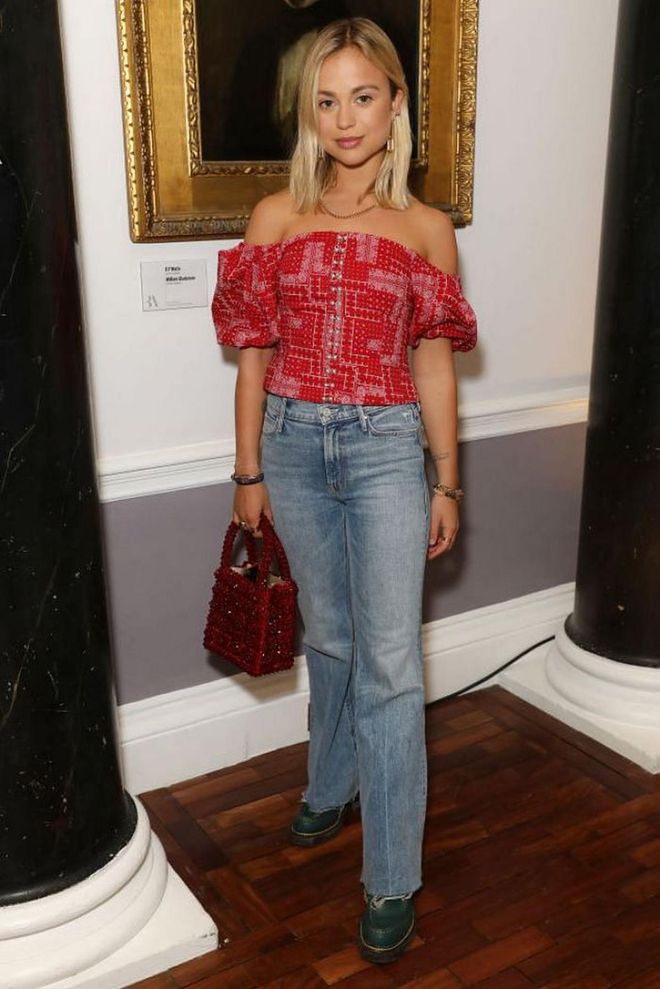Amelia Windsor styled her jeans with an off-the-shoulder top and ladylike Shrimps handbag.

Photo: Darren Gerrish / Getty